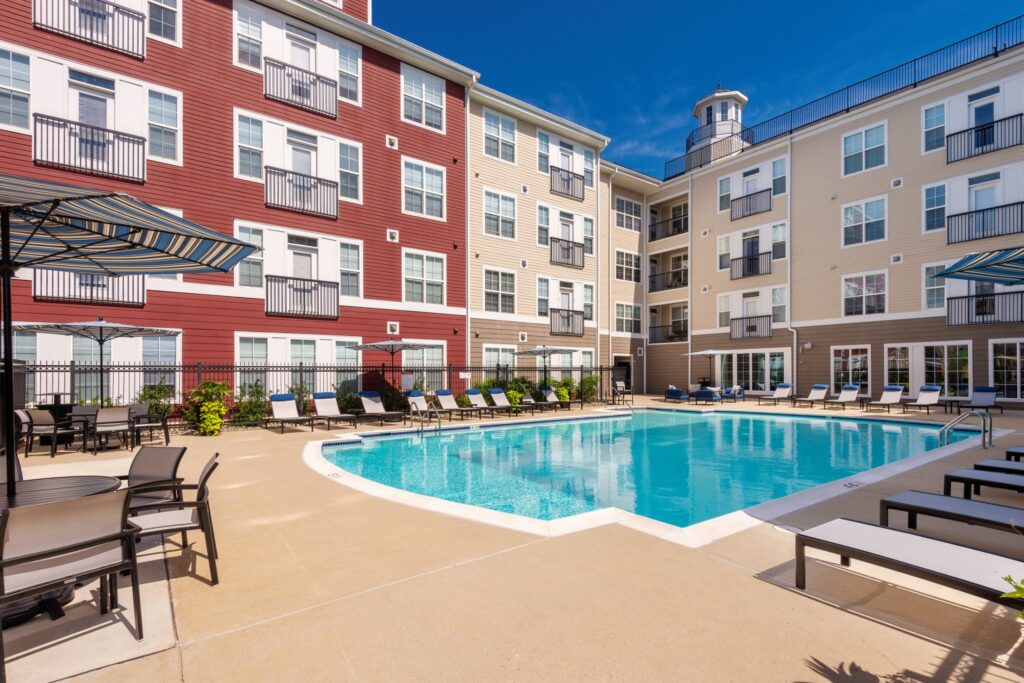 Pool courtyard with grilling stations and covered deck seating